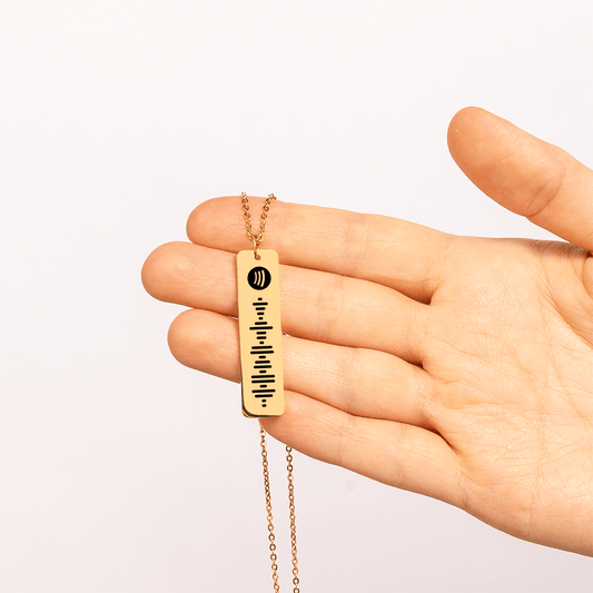 This image displays the Custom Spotify Necklace in hand. Choose from gold, silver and rose gold.